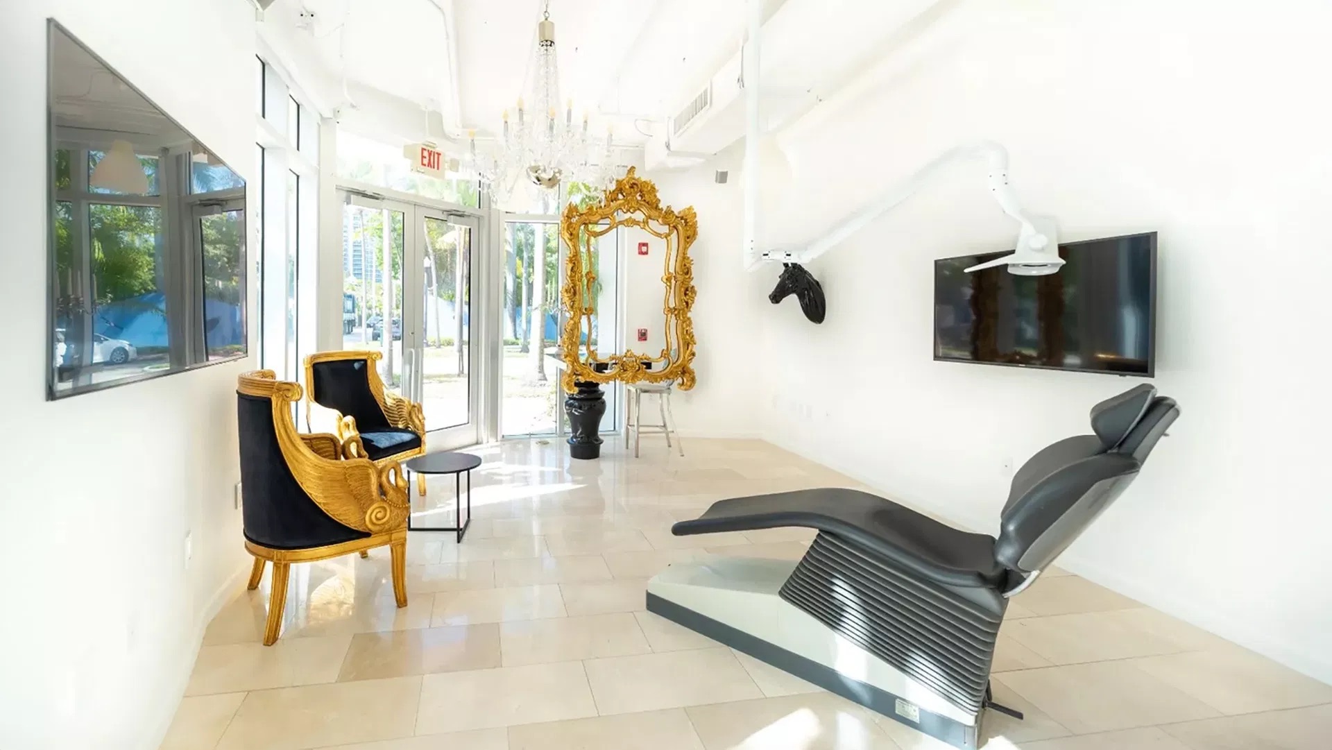 The image shows a modern dental clinic interior with various pieces of equipment, including a dental chair and an X-ray machine.